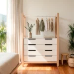Cómoda infantil Marlow con barra colgadora y cuatro cajones en acabado blanco con estructura de roble